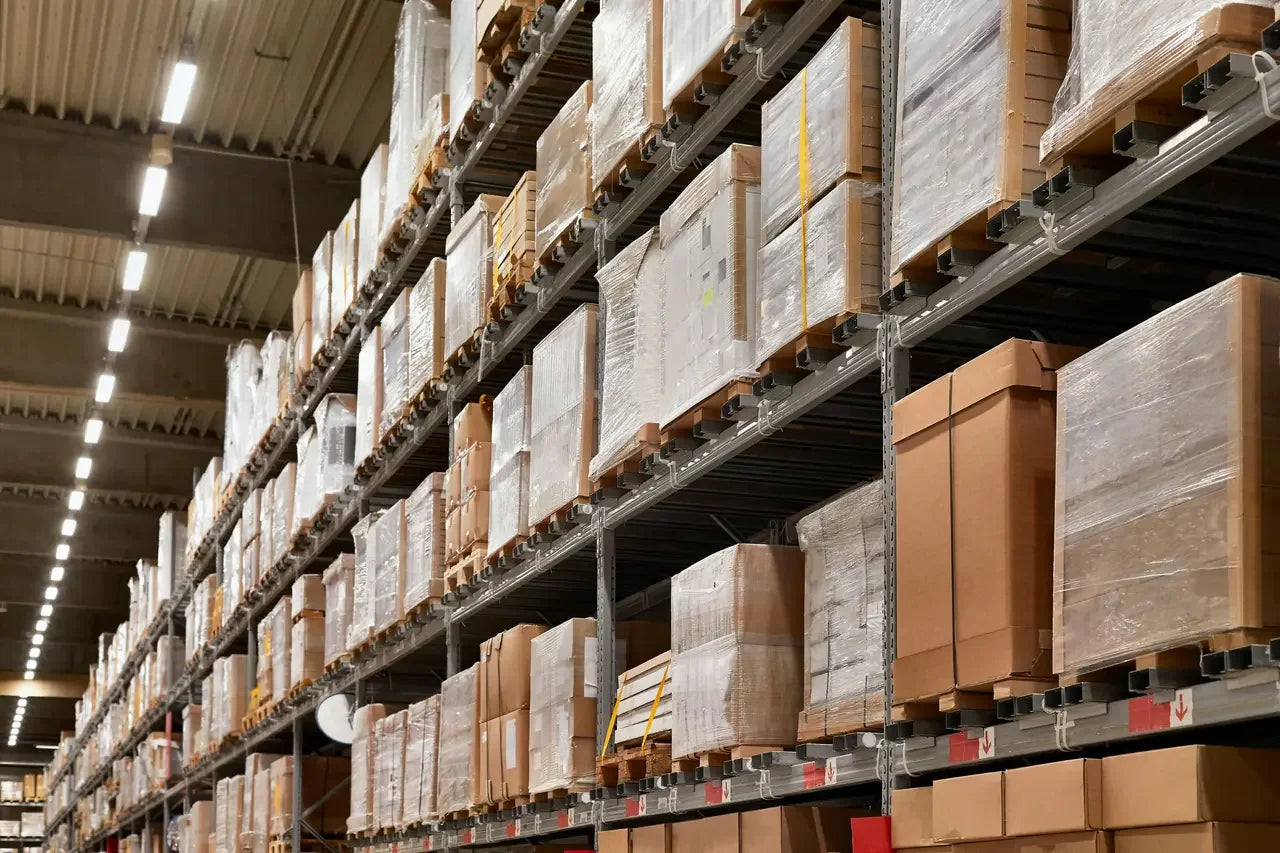 Industrial warehouse shelves stacked with power parts boxes and facility equipment