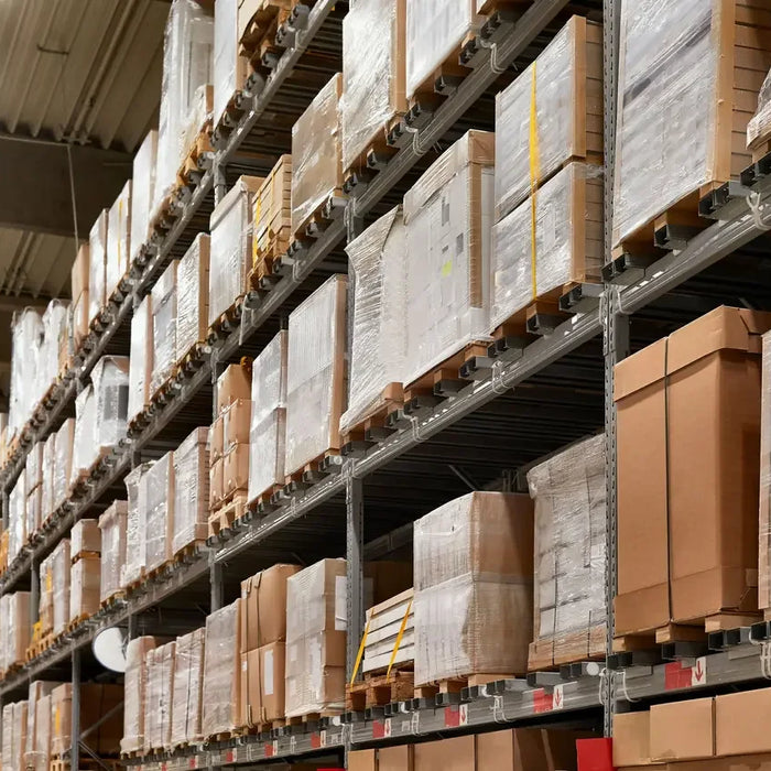 Industrial warehouse shelves stacked with power parts boxes and facility equipment