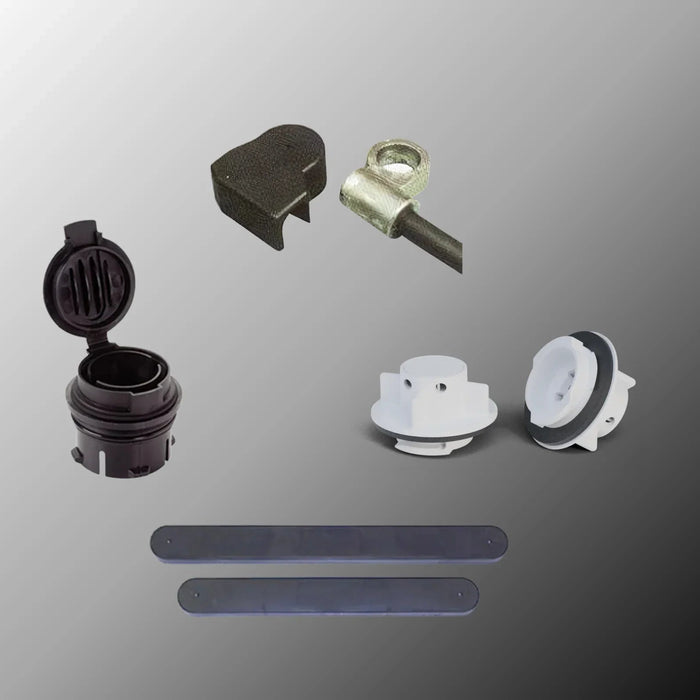 Assorted battery vent caps, terminal covers, and safety strips on a gradient background