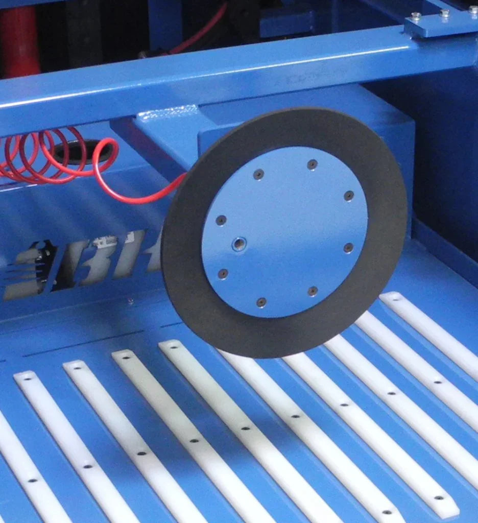 Blue industrial battery watering system component with black rubber gasket and metal frame