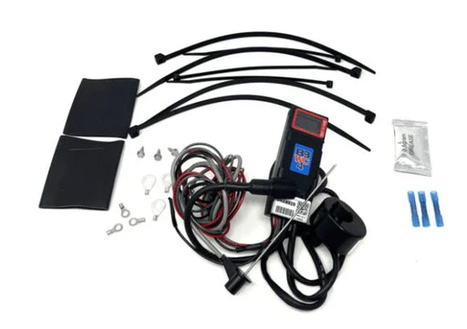 Battery monitor installation kit with wires, connectors, zip ties, heat shrink tubing, and digital display.