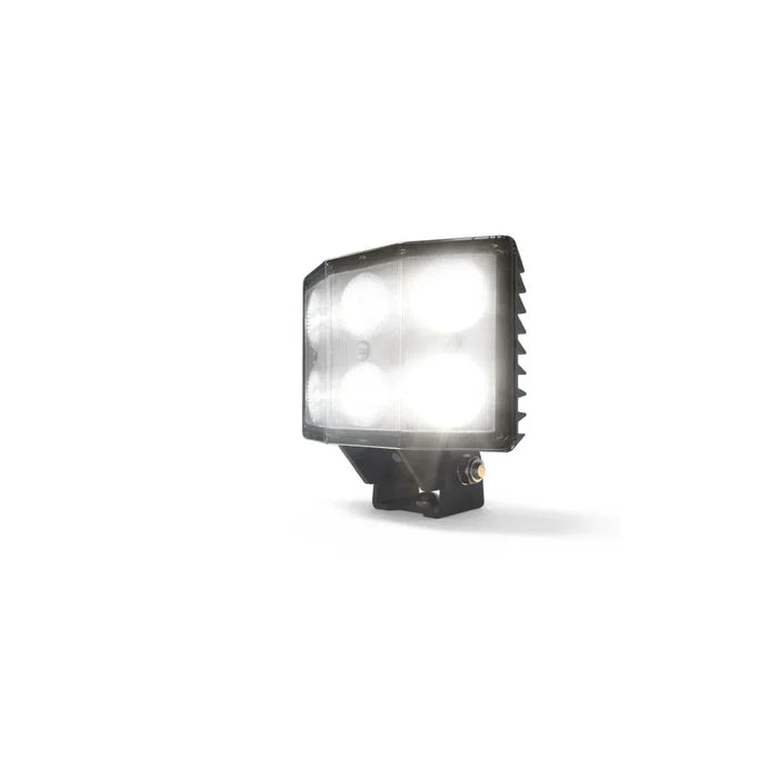Square LED work light with four illuminated bulbs and heat sink, isolated on white background.