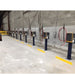 Industrial battery charger stands with control panels and cables in a warehouse setting