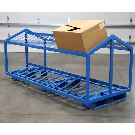 Heavy-duty blue metal pick rack with slotted shelves and a cardboard box on top, warehouse setting